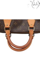 Sold Attire Louis Vuitton Speedy 30 Monogram canvas handbag with natural Vachetta leather trim and handles, brass hardware, and top zip closure.