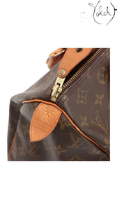 Sold Attire Louis Vuitton Speedy 30 Monogram canvas bag with Vachetta leather trim and brass hardware. Circa 2000.