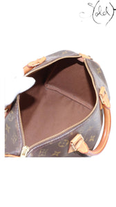 Sold Attire Louis Vuitton Speedy 30 Monogram canvas bag with natural Vachetta leather trim and handles, circa 2000.