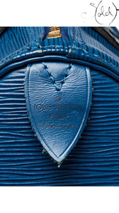 Sold Attire vintage Louis Vuitton Speedy 30 in Toledo blue Epi leather with gold-tone hardware and heat stamp detail.