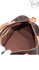 Sold Attire Louis Vuitton Speedy 25 Monogram Canvas brown textile interior with leather trim and gold-tone zipper.