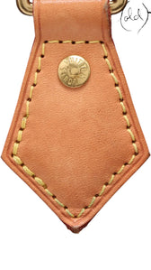 Sold Attire Louis Vuitton Speedy 25 Monogram Canvas bag with gold-tone hardware and vachetta leather trim.
