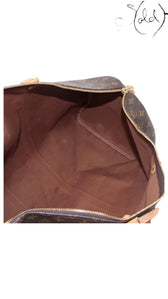 Sold Attire Louis Vuitton Keepall 55 interior view showing brown cotton textile lining and monogram coated canvas