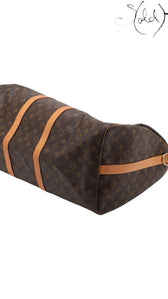 Sold Attire Louis Vuitton Keepall Bandoulière 55 travel bag in brown Monogram coated canvas with leather trim.