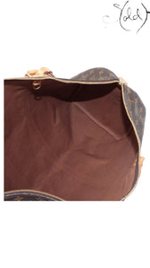 Sold Attire interior view of a vintage Louis Vuitton Keepall 55 travel bag with brown cotton textile lining