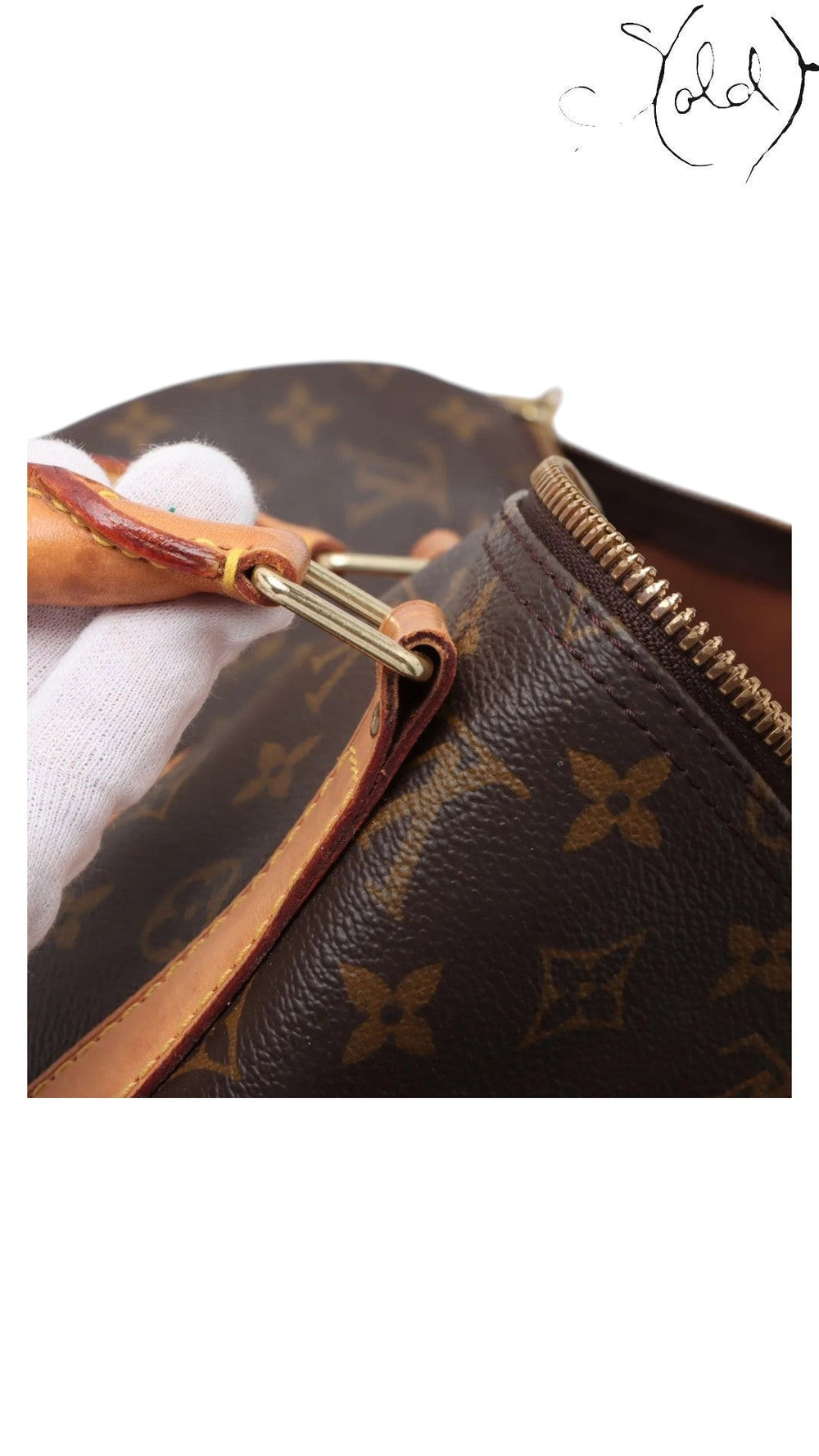 Sold Attire Louis Vuitton Keepall 55 travel bag showing monogram canvas, leather handle attachment, and gold hardware.