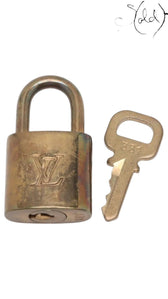 Sold Attire vintage Louis Vuitton gold-tone brass padlock and key with engraved LV logo and number 331