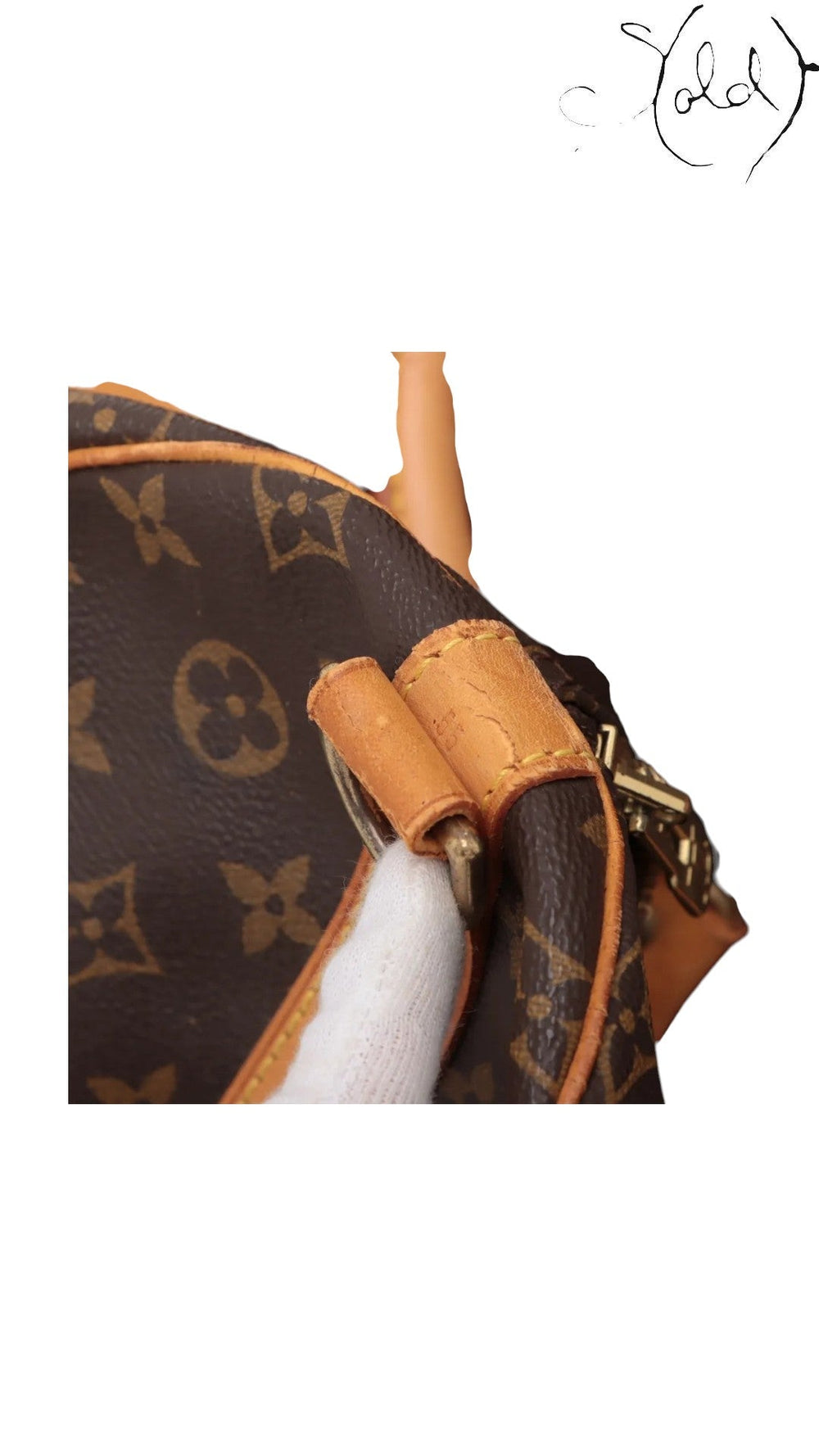 Sold Attire Louis Vuitton Keepall 55 detail showing monogram canvas, vachetta leather trim, and gold-tone hardware.