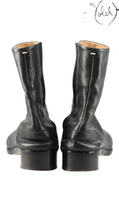 Sold Attire black leather Maison Margiela Tabi short boots with split-toe construction and low block heel.