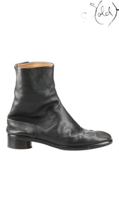 Sold Attire black leather Maison Margiela Tabi short boots with split-toe and side zip closure.