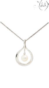 Sold Attire vintage Mikimoto sterling silver pendant necklace featuring a cream cultured pearl in a teardrop frame.
