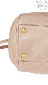 Sold Attire Miu Miu Vitello Lux Bow Bag in Fumo grey distressed leather with gold-tone hardware and protective feet.