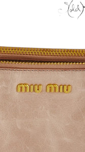 Sold Attire Miu Miu Vitello Lux Bow Bag in Fumo smoke grey leather with gold-tone hardware and dual bow accents.
