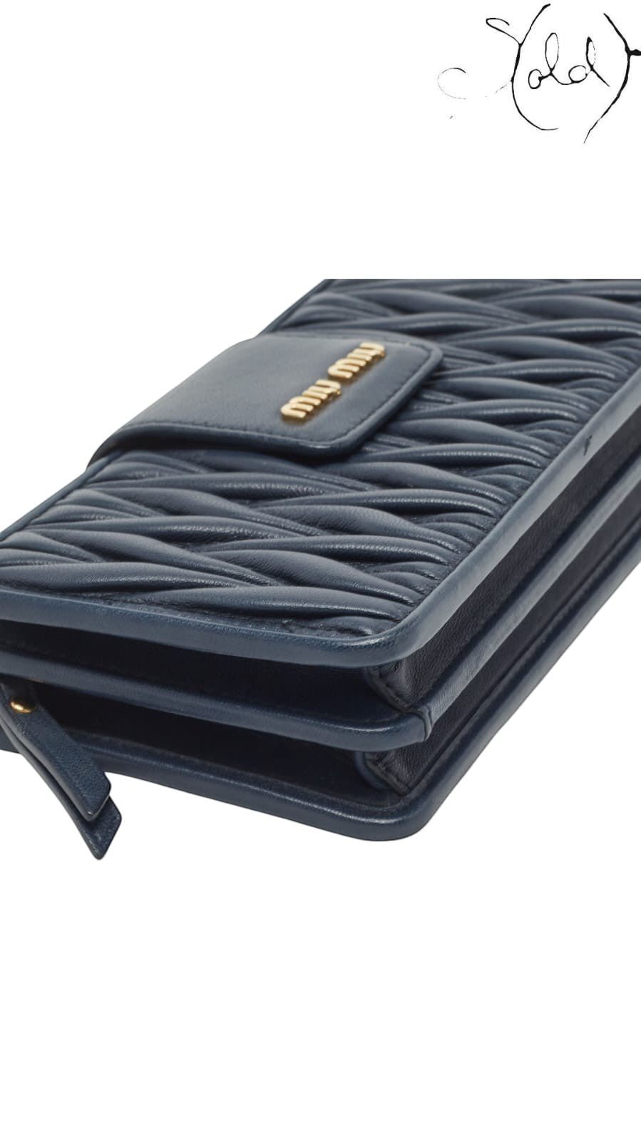 Sold Attire navy blue matelasse leather Miu Miu phone bag with gold tone logo detail.