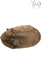 Sold Attire brown Prada Tessuto nylon tote bag base with gold-tone protective studs and leather trim details