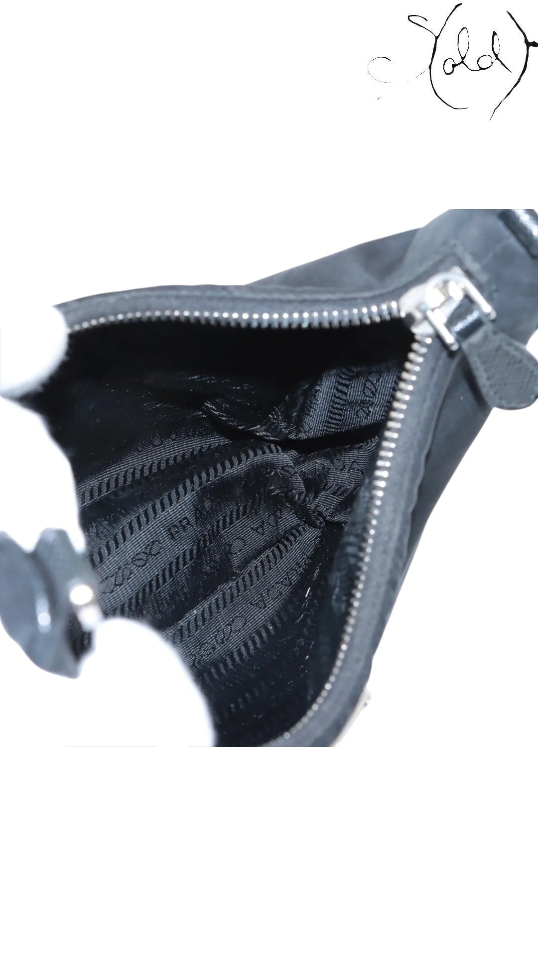 Sold Attire black Prada Re-Edition 2005 nylon shoulder bag with Saffiano leather trim and silver hardware.