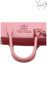 Sold Attire pink Saffiano leather Prada Monochrome Tote Mini with city calf trim and gold hardware.