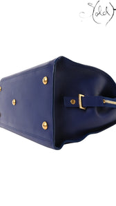Sold Attire Saint Laurent Medium Classic Y Cabas tote in royal blue calfskin leather with gold-tone base studs.