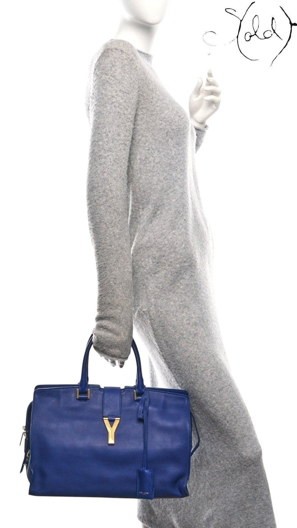 Sold Attire model carrying a royal blue Saint Laurent Medium Classic Y Cabas tote with gold hardware.