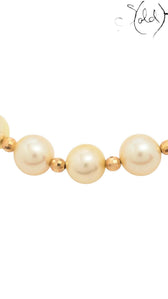 Sold Attire cream Akoya pearl necklace and bracelet set featuring round pearls and faceted silver beads.
