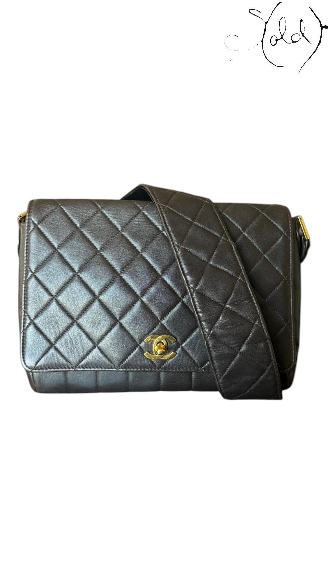 Sold Attire chocolate brown quilted lambskin Chanel Classique Single Full Flap bag with 24k gold CC turn-lock and strap.