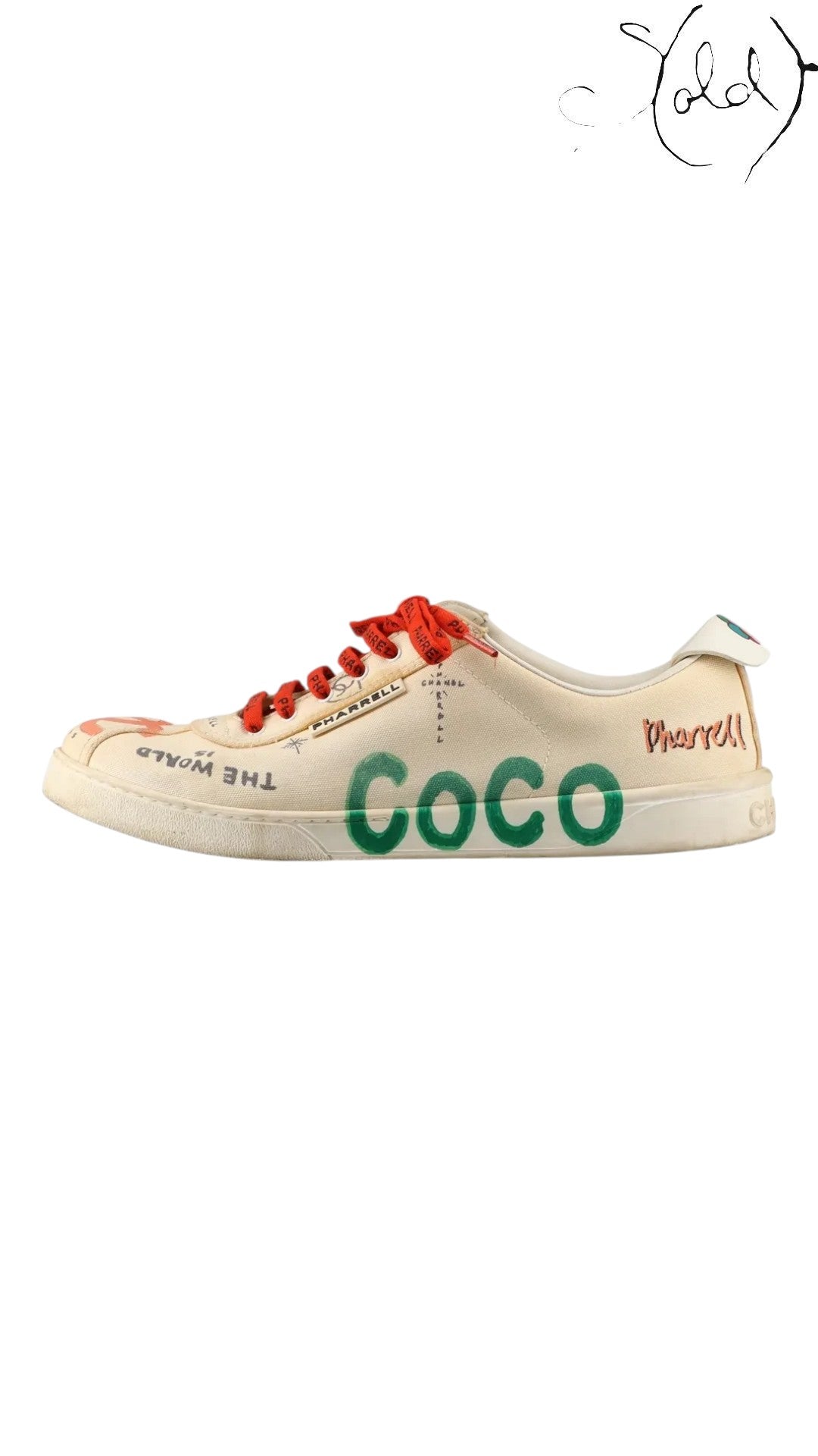 Sold Attire Chanel x Pharrell low-top sneakers in white canvas with green COCO lettering, red laces, and graphic print.