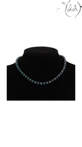 Sold Attire dark green-blue Akoya pearl necklace on a black display bust