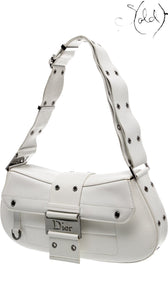 Sold Attire vintage Dior Street Chic white leather shoulder bag with silver-tone hardware and adjustable strap.