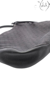 Sold Attire Gucci 00s shoulder bag in black GG Supreme canvas with textured calfskin leather trim and silver hardware.