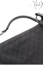 Sold Attire vintage Gucci 00s black GG Supreme canvas shoulder bag with calfskin leather trim and silver hardware