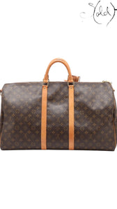 Sold Attire Louis Vuitton Keepall Bandoulière 55 in brown Monogram coated canvas with natural cowhide leather trim.