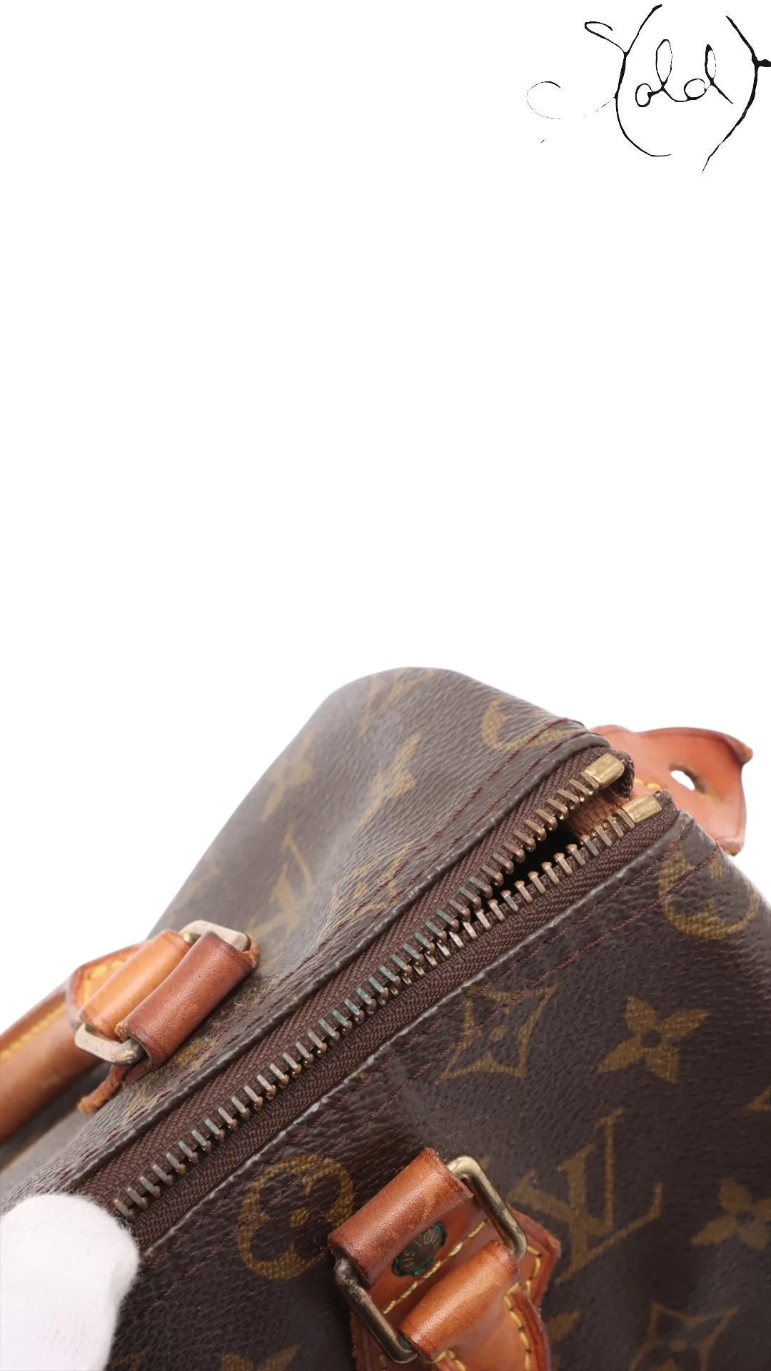 Sold Attire Louis Vuitton Monogram Speedy 25 brown coated canvas with vachetta leather trim and brass hardware.