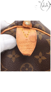 Sold Attire Louis Vuitton Speedy 30 interior leather heat stamp tab with Made in France branding on Monogram canvas