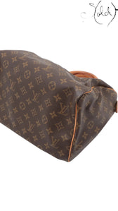 Sold Attire vintage Louis Vuitton Speedy 30 bag in brown monogram coated canvas with vachetta leather trim and piping.