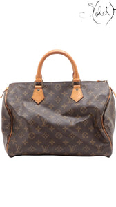 Sold Attire vintage Louis Vuitton Speedy 30 in brown Monogram coated canvas with honey patina vachetta leather handles.