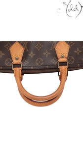 Sold Attire vintage Louis Vuitton Speedy 30 bag featuring brown monogram canvas and honey-patina vachetta leather handles.