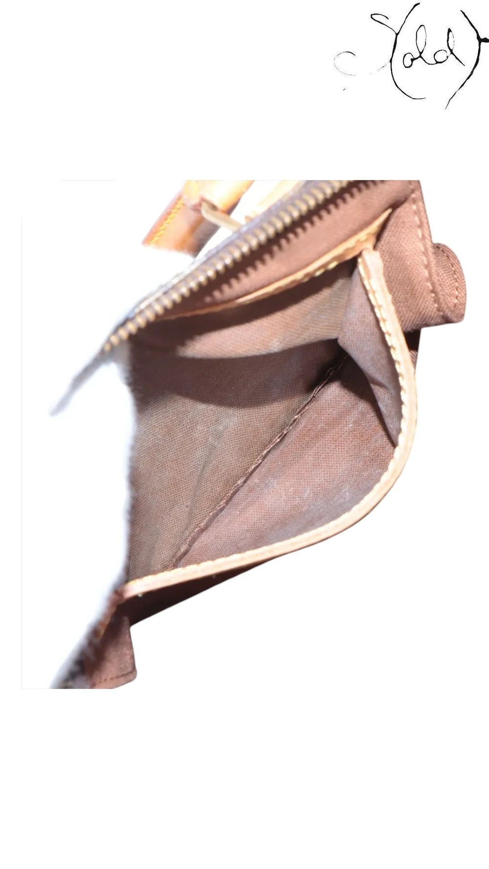Interior of a vintage Sold Attire Louis Vuitton Speedy 30 bag showing clean brown textile lining and stitching