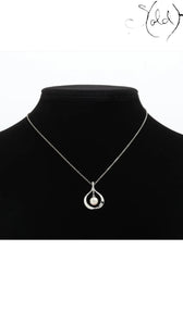 Sold Attire Mikimoto pearl pendant necklace featuring a cream cultured pearl set in a sterling silver teardrop frame.
