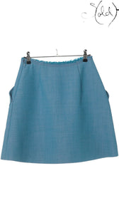 Sold Attire blue Miu Miu wool and polyester flared mini skirt with front pockets and frayed waist detail