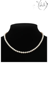 Sold Attire pre-owned TASAKI single-strand cream pearl necklace with SV silver clasp on a black display bust